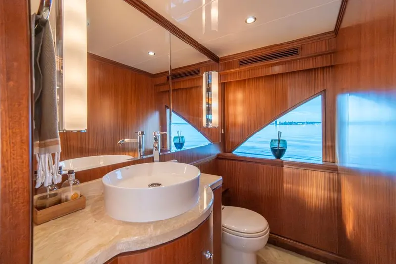 Slide: The Image of Luxurious bathroom in 2010 Ocean Alexander 80' Motoryacht with wood paneling and modern fixtures. - 22