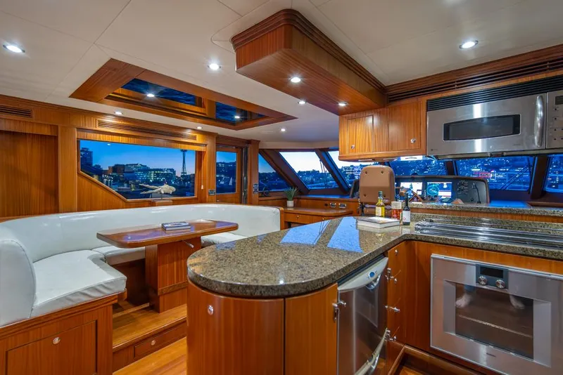 Slide: The Image of Luxurious interior of 2010 Ocean Alexander 80' Motoryacht with modern kitchen and dining area. - 25