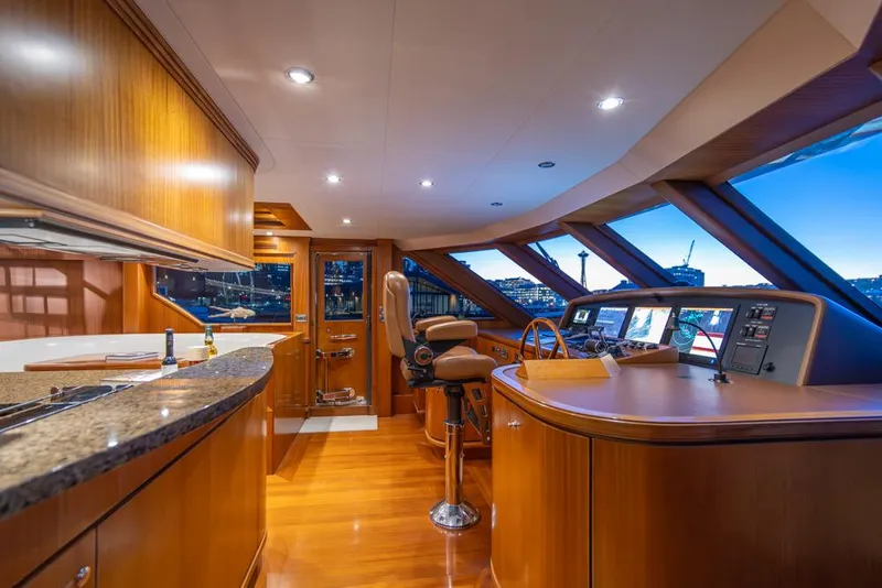 Slide: The Image of Luxurious interior of 2010 Ocean Alexander 80' Motoryacht with elegant wood finishes and modern helm. - 28