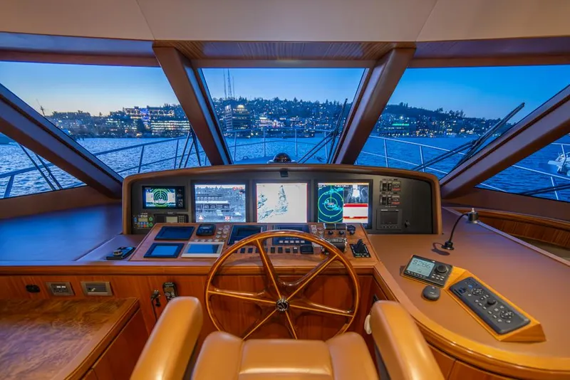 Slide: The Image of Cockpit of 2010 Ocean Alexander 80' Motoryacht with navigation screens and city view. - 30