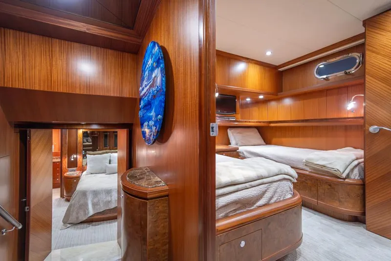 Slide: The Image of Luxurious 2010 Ocean Alexander 80' Motoryacht interior with elegant wood paneling and cozy twin beds. - 31