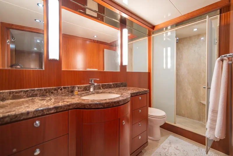 Slide: The Image of Luxurious bathroom in 2010 Ocean Alexander 80' Motoryacht with marble countertop and wood cabinetry. - 35