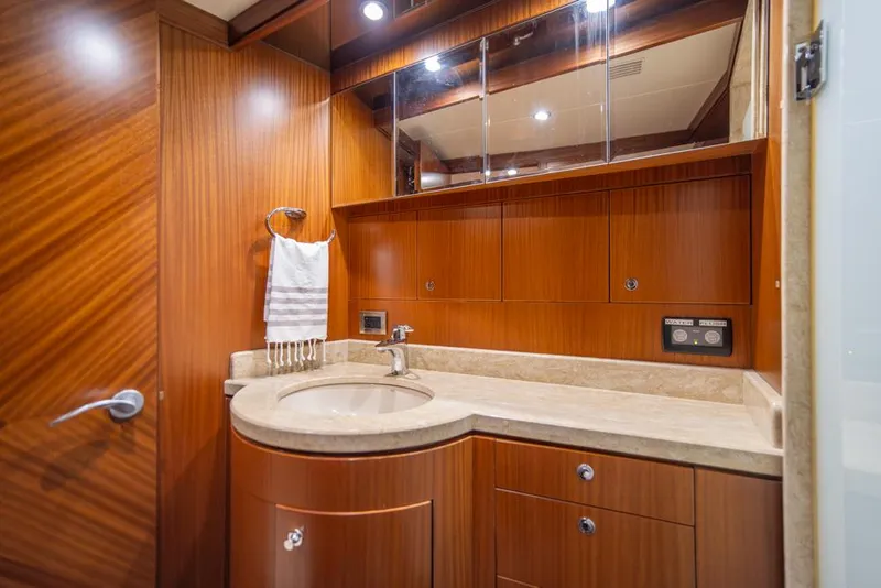 Slide: The Image of Luxurious bathroom in 2010 Ocean Alexander 80' Motoryacht with wood cabinetry and modern fixtures. - 36