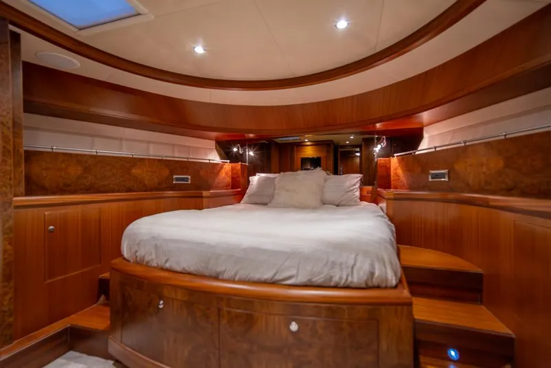 Slide: The Image of Luxurious bedroom in 2010 Ocean Alexander 80' Motoryacht with elegant wood finishes. - 37
