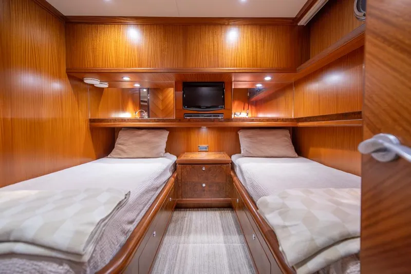 Slide: The Image of Luxurious twin cabin in 2010 Ocean Alexander 80' Motoryacht with wood paneling and modern amenities. - 38