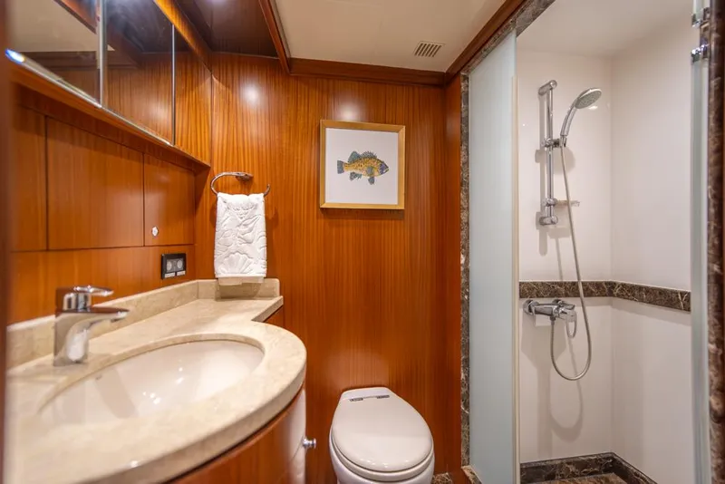 Slide: The Image of Luxurious bathroom on 2010 Ocean Alexander 80' Motoryacht with wood paneling and modern shower. - 39