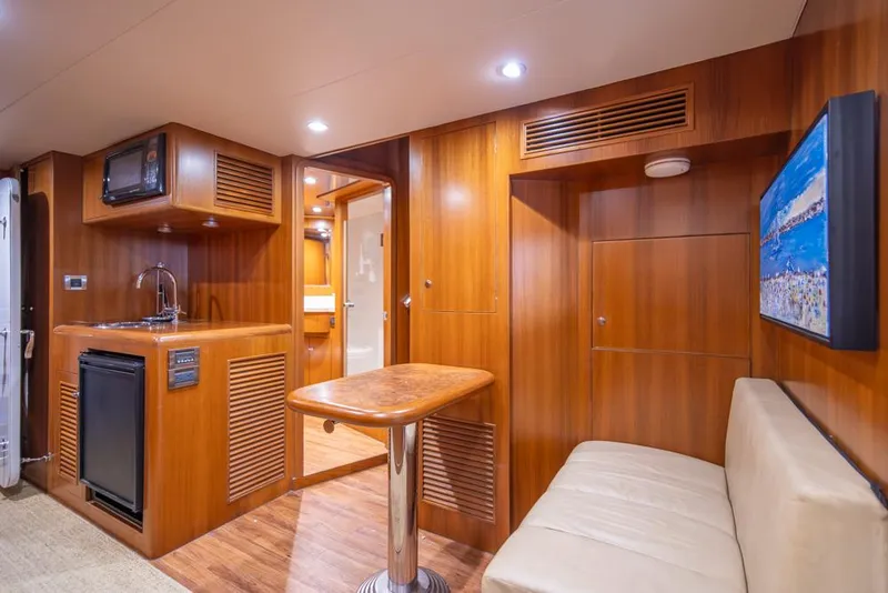 Slide: The Image of Luxurious interior of 2010 Ocean Alexander 80' Motoryacht with wood paneling and modern amenities. - 40