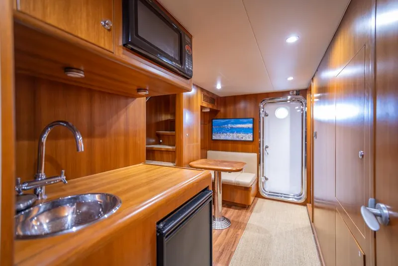 Slide: The Image of Luxurious interior of 2010 Ocean Alexander 80' Motoryacht with kitchenette and seating area. - 41