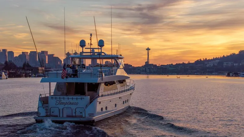 Slide: The Image of Ocean Alexander 80' Motoryacht cruising at sunset with city skyline in background, 2010 model. - 5