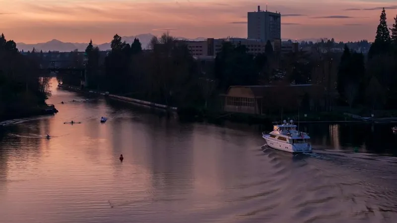 Slide: The Image of A 2010 Ocean Alexander 80' Motoryacht cruising on a serene river at sunset. - 6