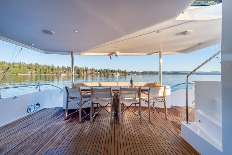 Slide: The Image of Luxurious Ocean Alexander 80' Motoryacht 2010 with elegant teak deck and scenic water view. - 8