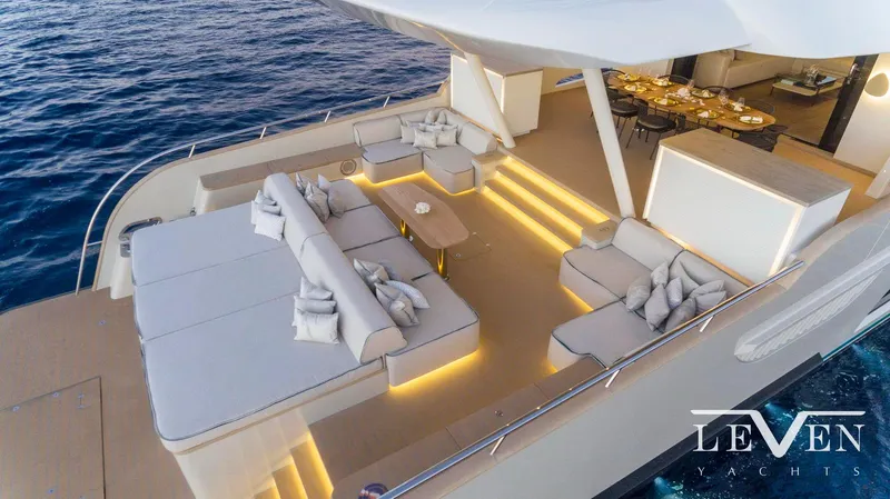 Slide: The Image of Luxurious Van der Valk LeVen 90 yacht deck with elegant seating, ambient lighting, and ocean view, 2026 model. - 15