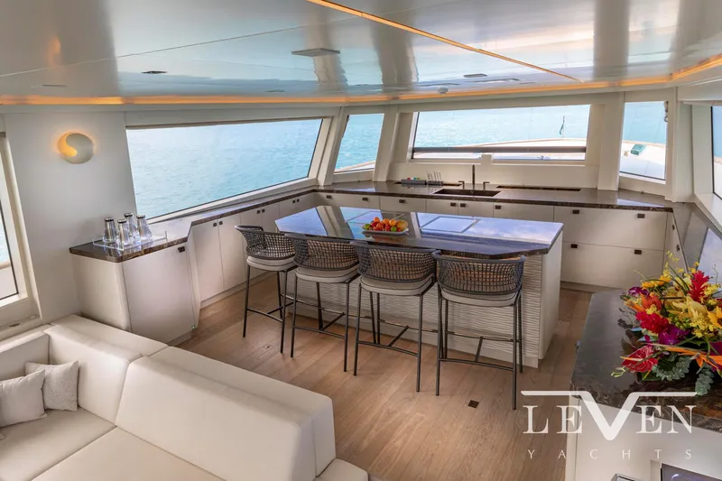 Slide: The Image of Luxurious interior of 2026 Van der Valk LeVen 90 yacht with modern bar and seating area. - 19