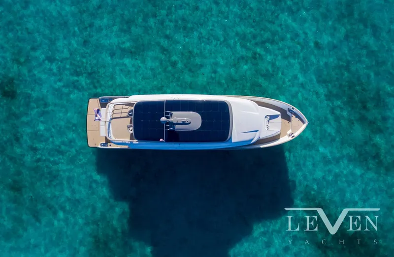 Slide: The Image of Aerial view of 2026 Van der Valk LeVen 90 yacht on clear turquoise water. - 5