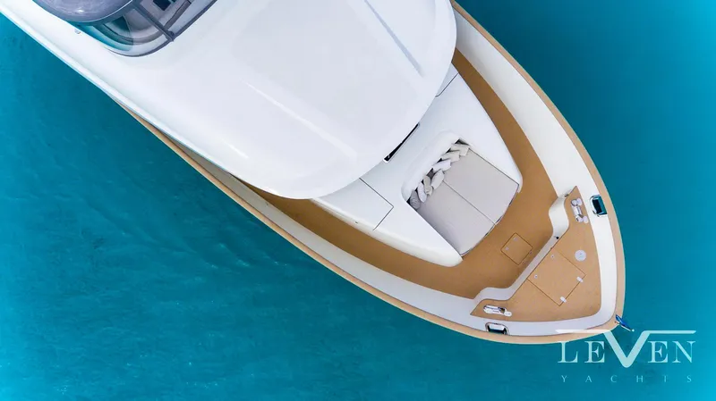 Slide: The Image of Aerial view of 2026 Van der Valk LeVen 90 yacht on turquoise water. - 6