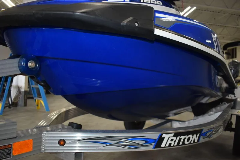 Slide: The Image of 2017 Yamaha WaveRunner GP1800 on Triton trailer, blue hull, indoor setting. - 29