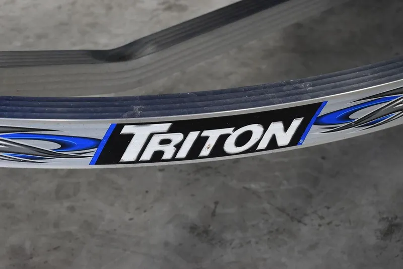 Slide: The Image of Triton trailer detail for 2017 Yamaha WaveRunner GP1800, featuring blue and black design elements. - 30