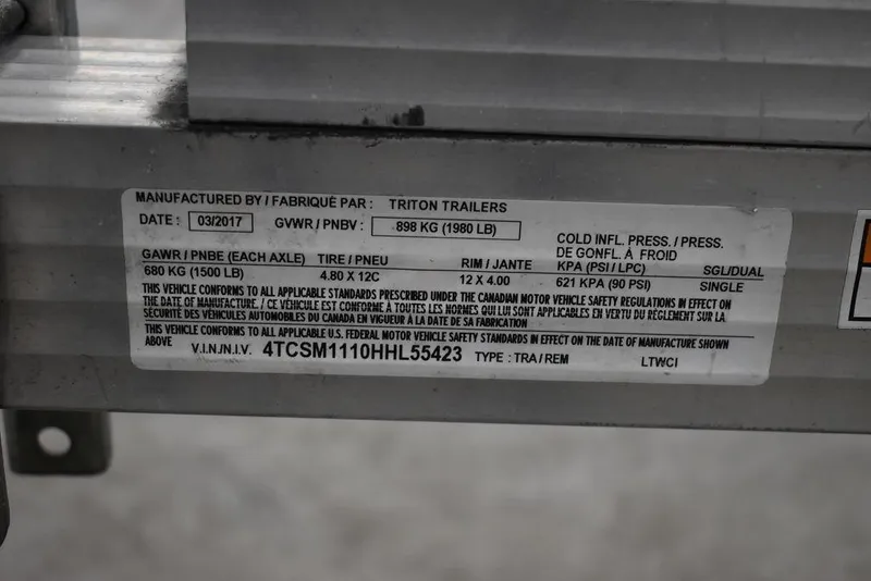 Slide: The Image of Sticker on Triton Trailer showing specifications and VIN, dated March 2017. - 31