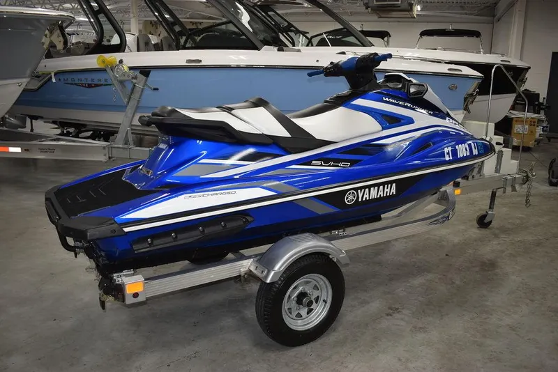 Slide: The Image of 2017 Yamaha WaveRunner GP1800 in blue on a trailer, parked indoors. - 6