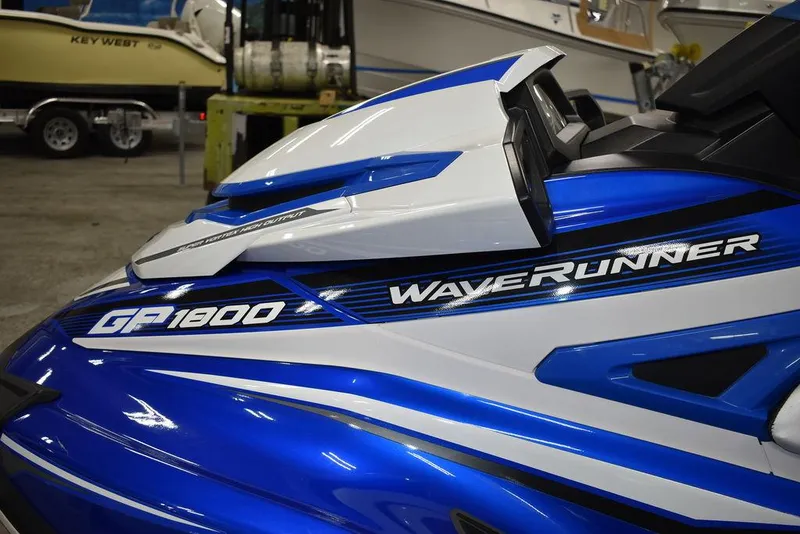 Slide: The Image of 2017 Yamaha WaveRunner GP1800 in blue and white, showcased indoors. - 8
