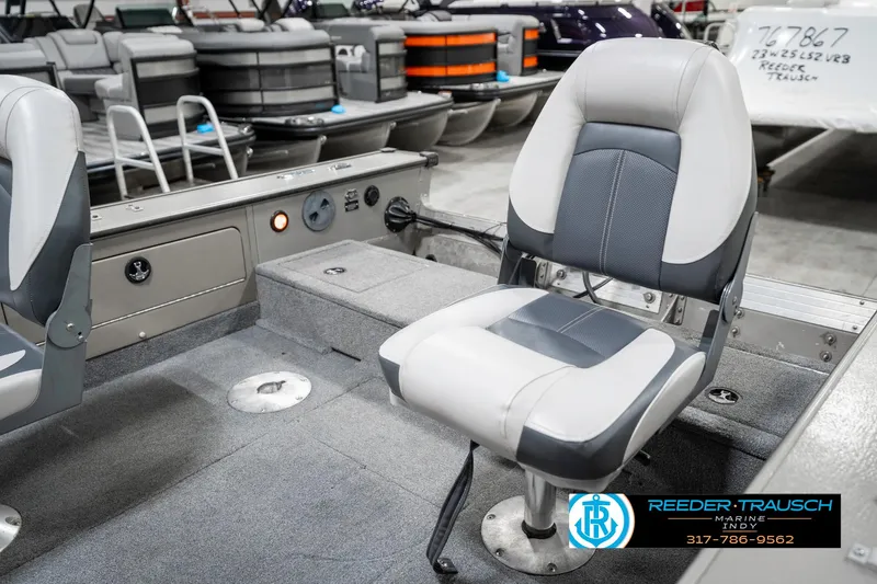 Slide: The Image of 2001 Lund 1775 Pro V SE boat interior with gray seating and storage compartments. - 33