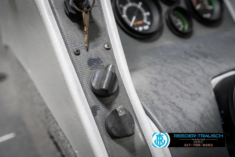 Slide: The Image of Control panel of a 2001 Lund 1775 Pro V SE boat with gauges and switches. - 38