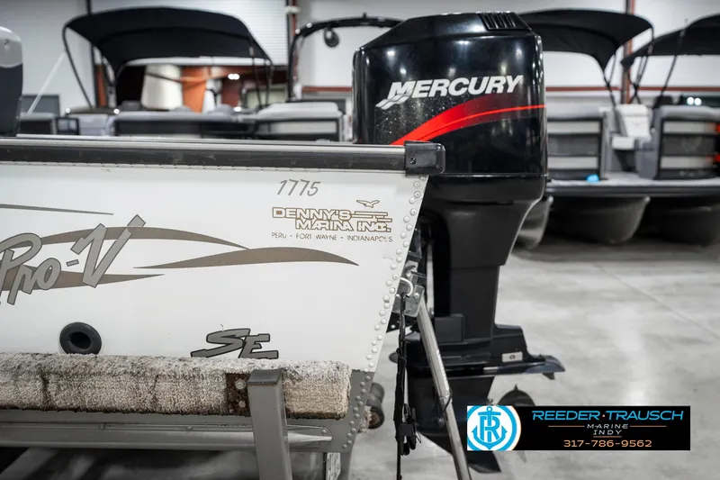 Slide: The Image of 2001 Lund 1775 Pro V SE boat with Mercury outboard motor in showroom. - 47