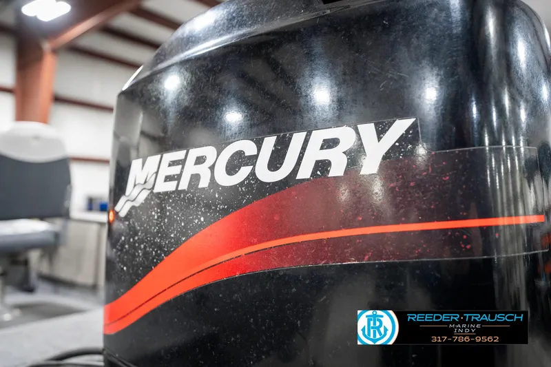 Slide: The Image of Mercury engine on 2001 Lund 1775 Pro V SE boat, indoor setting. - 48
