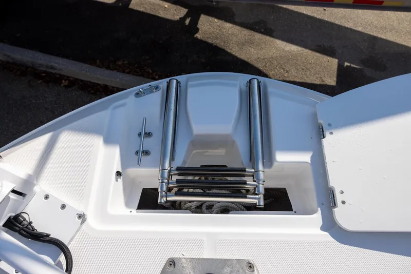 Slide: The Image of Bow view of 2022 Hurricane SunDeck Sport 205 OB with ladder and storage compartment. - 10