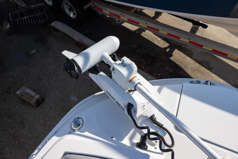 Slide: The Image of Trolling motor on 2022 Hurricane SunDeck Sport 205 OB boat, docked outdoors. - 11