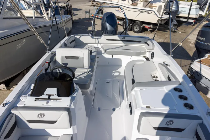 Slide: The Image of 2022 Hurricane SunDeck Sport 205 OB boat interior with seating and steering console. - 12