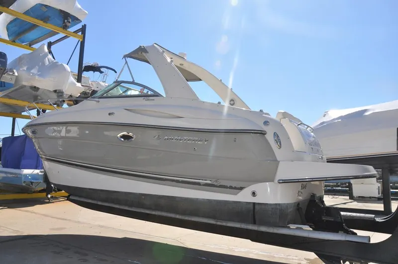 Slide: The Image of 2008 Monterey 270 Cruiser boat on dry dock under clear blue sky. - 12