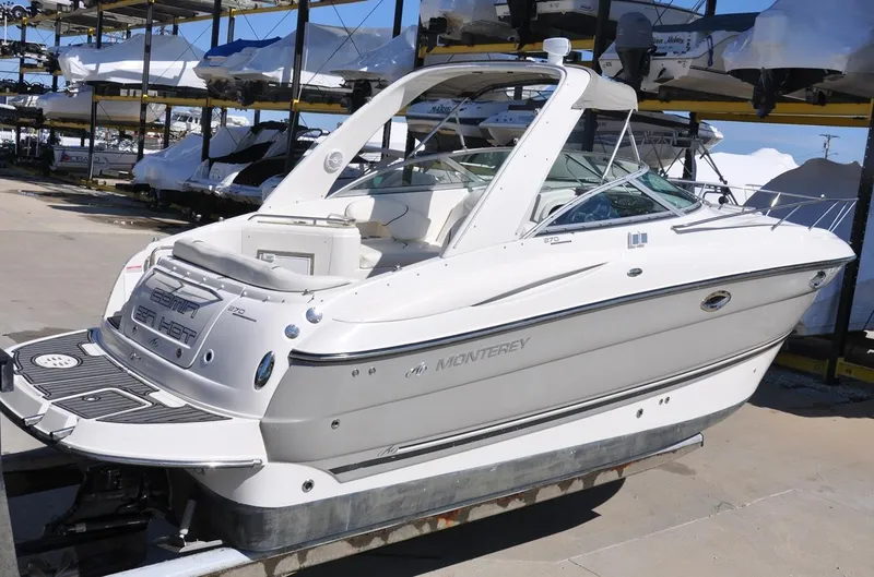 Slide: The Image of 2008 Monterey 270 Cruiser boat on trailer, dockside view. - 13