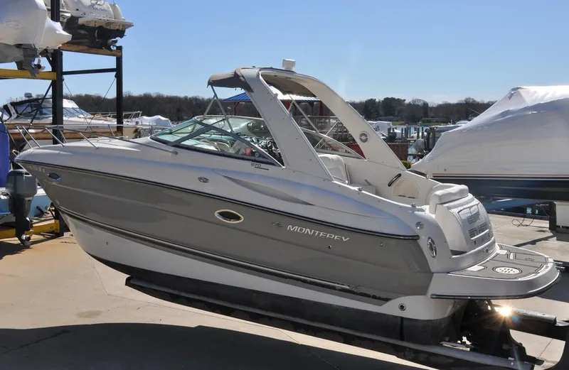 Slide: The Image of 2008 Monterey 270 Cruiser boat on display, featuring sleek design and modern amenities. - 14