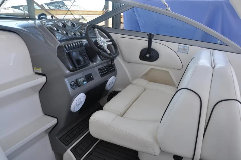 Slide: The Image of 2008 Monterey 270 Cruiser cockpit with white seating and modern dashboard controls. - 15