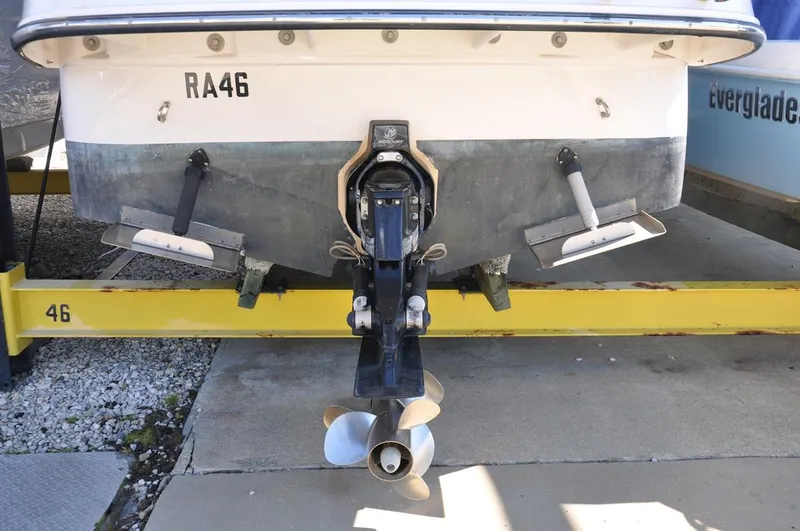 Slide: The Image of Rear view of a 2008 Monterey 270 Cruiser boat on a yellow stand. - 22