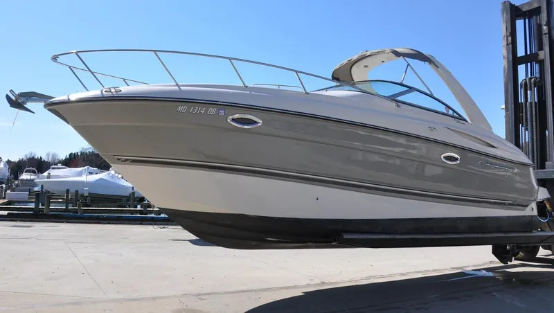 Slide: The Image of 2008 Monterey 270 Cruiser boat on a lift, side view. - 4