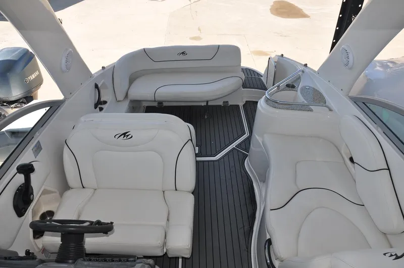 Slide: The Image of 2008 Monterey 270 Cruiser interior with white seating and sleek design. - 6