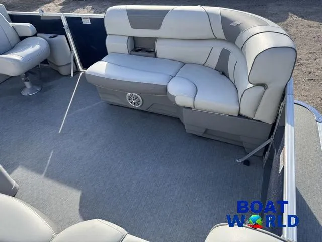 Slide: The Image of 2021 Starcraft EX 20 R Pontoon interior with gray seating and carpeted floor. - 10