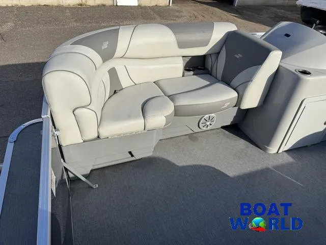 Slide: The Image of 2021 Starcraft EX 20 R Pontoon boat with gray seating and carpeted deck. - 11