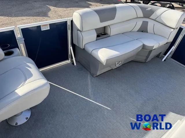 Slide: The Image of 2021 Starcraft EX 20 R Pontoon interior with gray seating and carpeted floor. - 12
