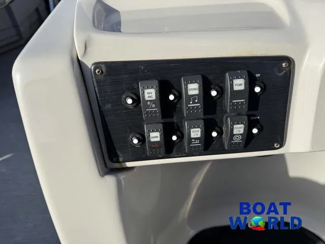 Slide: The Image of Control panel of 2021 Starcraft EX 20 R Pontoon boat with labeled switches. - 21