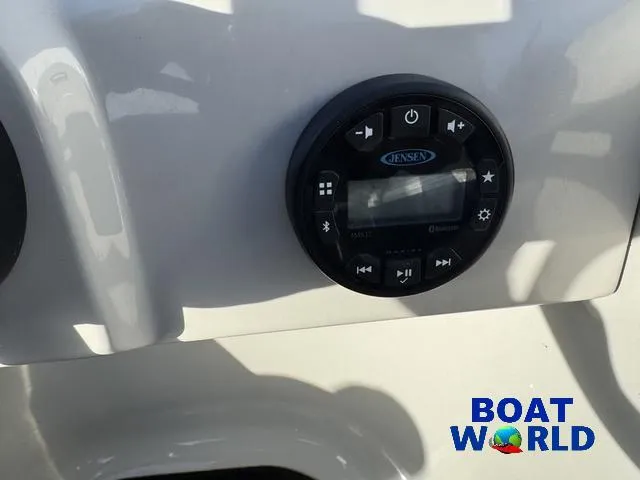Slide: The Image of 2021 Starcraft EX 20 R Pontoon audio control panel with Jensen system, Boat World logo visible. - 22