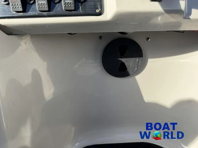 Slide: The Image of 2021 Starcraft EX 20 R Pontoon dashboard with control panel and Boat World logo. - 23