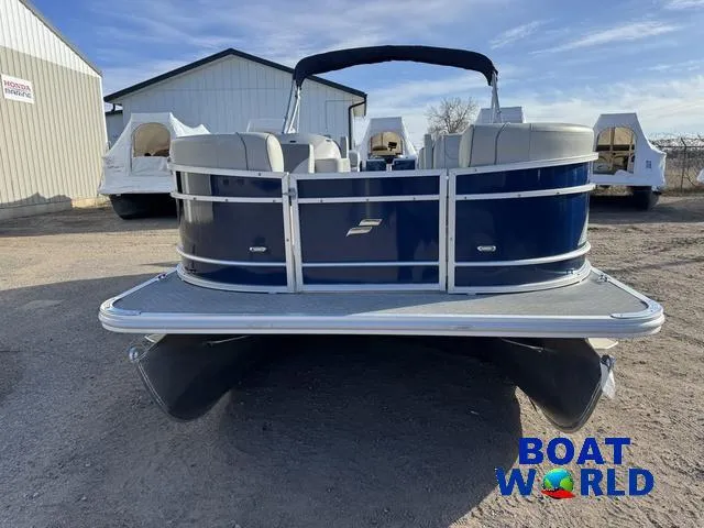 Slide: The Image of 2021 Starcraft EX 20 R Pontoon boat, blue exterior, displayed outdoors at Boat World dealership. - 26
