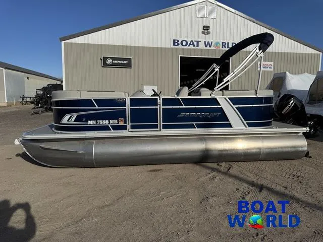 Slide: The Image of 2021 Starcraft EX 20 R Pontoon boat parked outside Boat World dealership. - 30