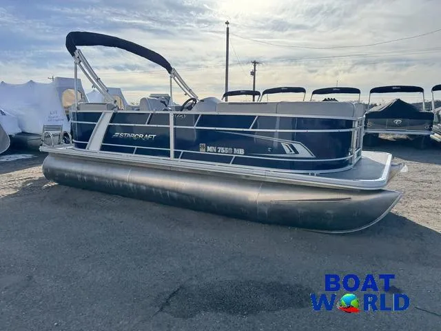 Slide: The Image of 2021 Starcraft EX 20 R Pontoon boat in a parking lot, featuring a sleek design. - 36