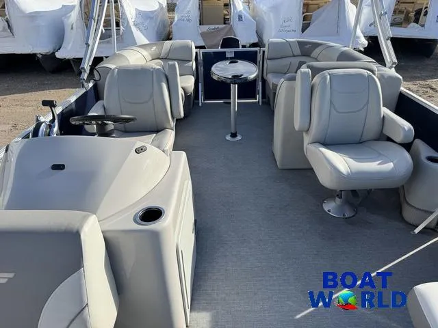Slide: The Image of 2021 Starcraft EX 20 R Pontoon boat interior with plush seating and steering console. - 4