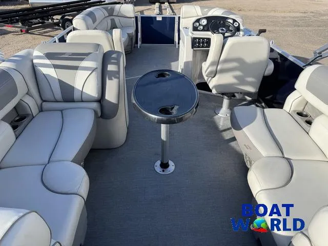Slide: The Image of 2021 Starcraft EX 20 R Pontoon interior with plush seating and central table. - 5