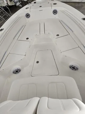 Slide: The Image of 2025 Regulator 24XO boat interior with seating and storage compartments. - 9